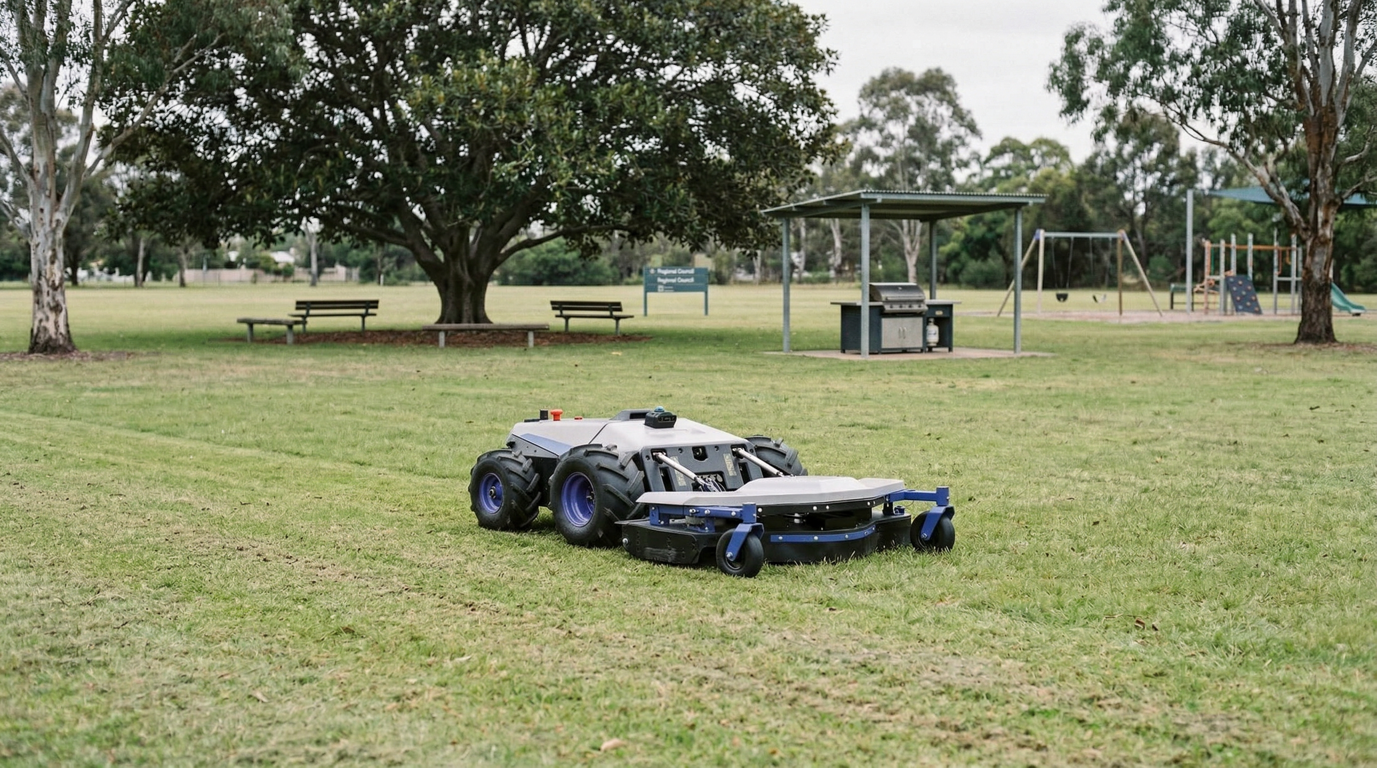 PANDAG G1 mowing a public park with BBQ shelter and playground